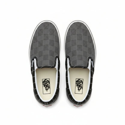 Grey Vans Classic Slip-On sneakers by Raw Movement with a casual low-top design and comfortable canvas upper.