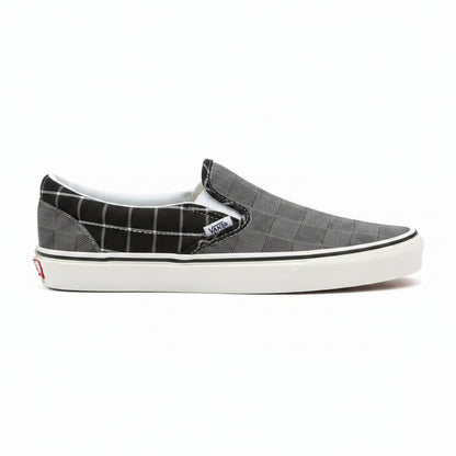 Grey Vans Classic Slip-On sneakers from Raw-Movement featuring a sleek low-top design and comfortable canvas material.